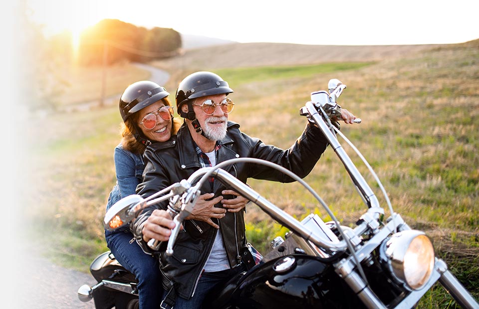 image of two people on a motorbike