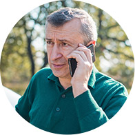 Image shows man talking on the phone