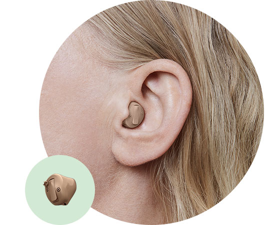 Image shows in-the-canal hearing aid in ear